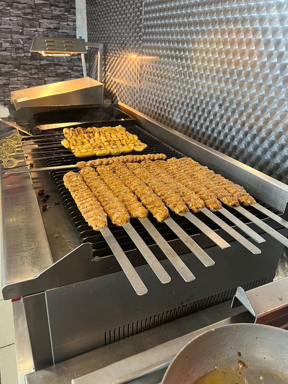 Kebab skewers grilling for event catering